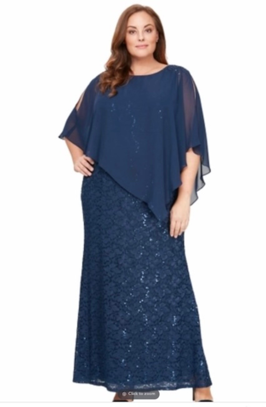A woman wearing a long, elegant navy blue dress with a cape-like overlay.