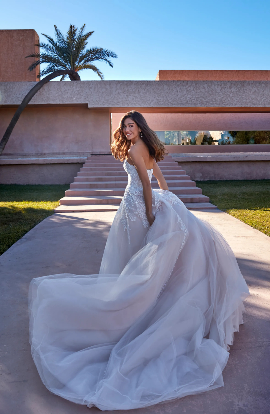 model is wearing a strapless a-line wedding dress