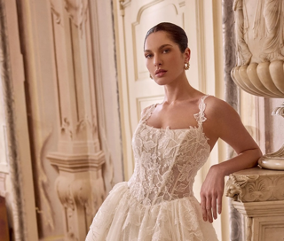 Photo of the model wearing a white bridal gown