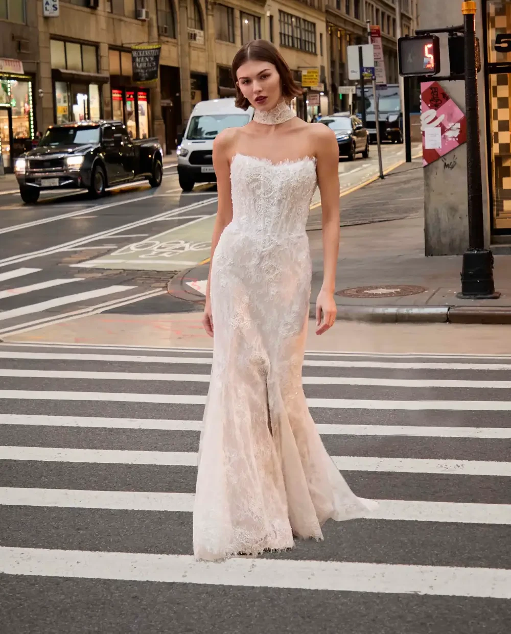 Photo of the model wearing a white bridal gown